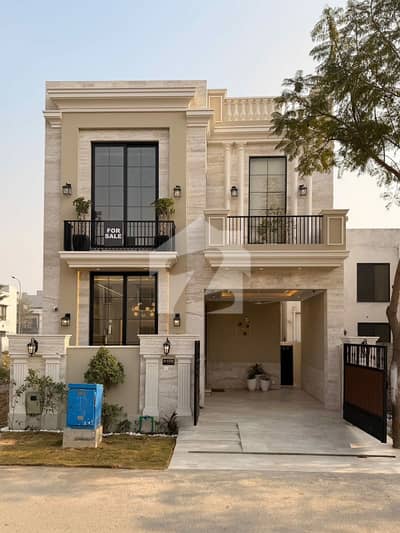 On Wide 50-Feet Road 5-Marla Brand New Luxury Ultra-Modern Design Most Beautiful Bungalow For Sale At Prime Location Of DHA Lahore Near To Park Masjid & Commercial Market.