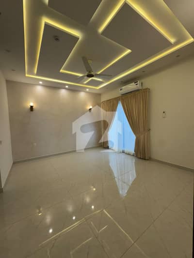 Elegant 1-Kanal Brand New Residence Available for Rent in DHA Phase 7 6 Beds, 2 TV Lounges, 2 Kitchens & Fully Developed Basement
