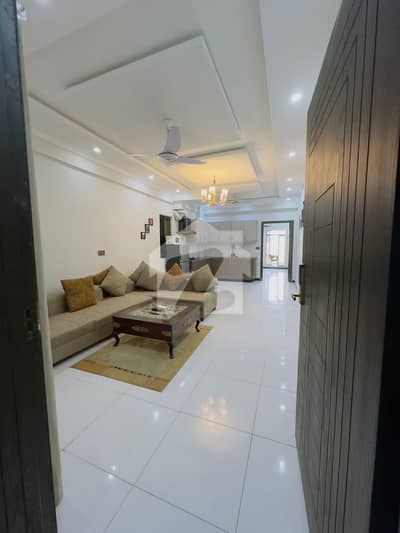 E-11/4 Madina Tower (2 bedroom apartment available for sale).