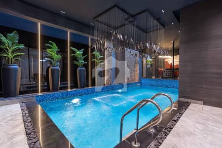INDOOR SWIMMING POOL 1 KANAL ULTRA MODERN FULLY FURNISHED LUXURY DESIGN VILLA FOR SALE IN DHA PHASE 7 .