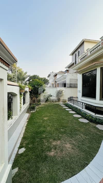 Live In Luxury With The Best View In The Phase 6 Available For Rent The Stunning Ground Floor & Basement Of A Premium 1 Kanal House, Directly Facing A Green Park In DHA Phase 6