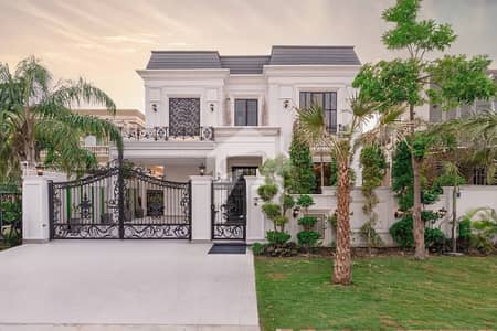 1 KANAL WHITE CLASSIC STYLE VILLA WITH MINI POOL FOR SALE IN DHA PHASE 6 NEAR TO RAYA.