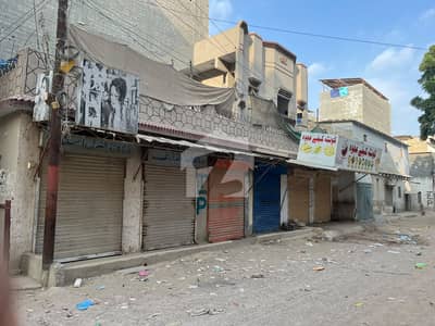 128 Sq. Yards Corner House With 6 Shops For Sale On Main Road Sector 11-G, New Karachi