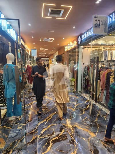 Centrally Located Shop Available In Rashid Minhas Road For Rent
