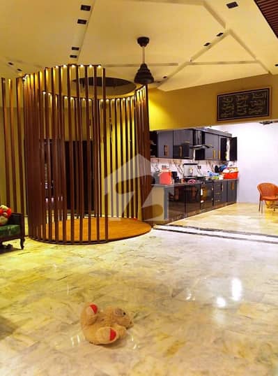 URGENT SALE 1000 yards House Gulshan-e-Iqbal - Block 4,  Leased Fully renovated and modern architecture 7 Beds, 6 baths, Swimming pool, Solar Demand: 23 cror