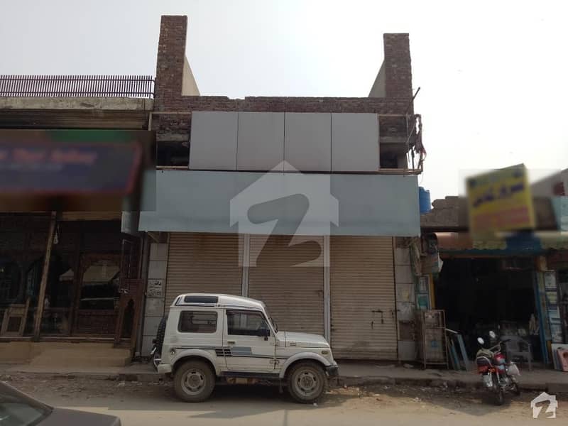 11 Marla Main Boulevard Commercial Building For Sale On Good Location With 3 Shops & Flats