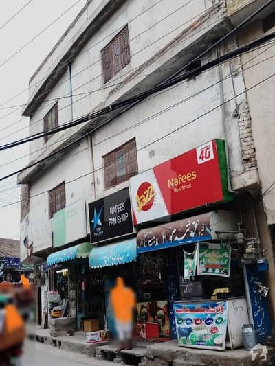 5 and half Marla Building 4 Shops 3 house portions Main Road 54 ft front People Colony Tench Bhatta 5 and half Marla Building 4 Shops 3 house portions Main Road 54 ft front People Colony Tench Bhatta