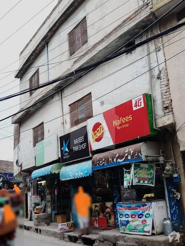 5 and half Marla Building  4 Shops 3 house portions  Main Road  54 ft front  People Colony Tench Bhatta