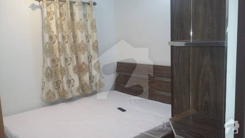 fully furnished flat with 2 rooms for rent in Model Town Lahore best for bachhelors and families rent 22000