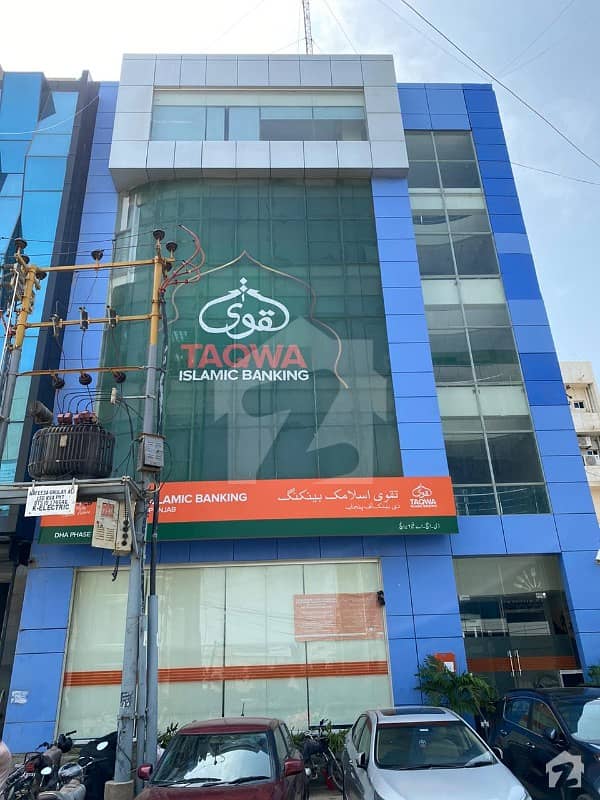 dha 200 yards shahbaz commercial lane 4 and  26 street ne corner bank of punjab building ideal for monthly income  for sale prime rental income building